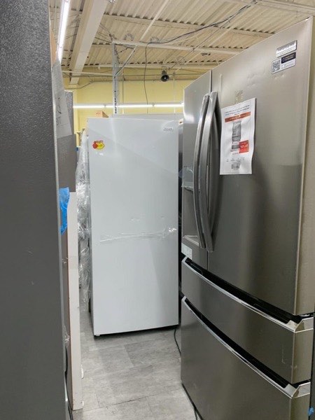 Middletown Home Outlet appliance aisle with refrigerators and washers