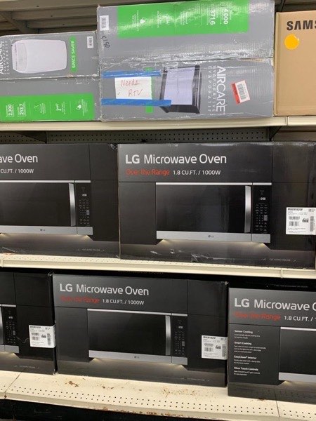 Over-the-range microwave ovens in shelf display
